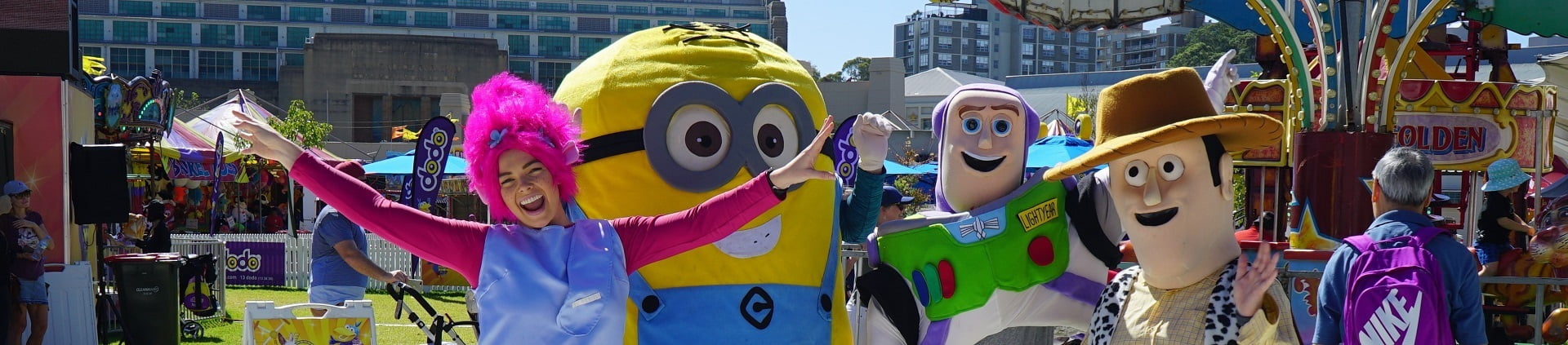 image of corporate event roving entertainers Poppy Troll, Minion, Buzz Lightyear, Woody the Cowboy