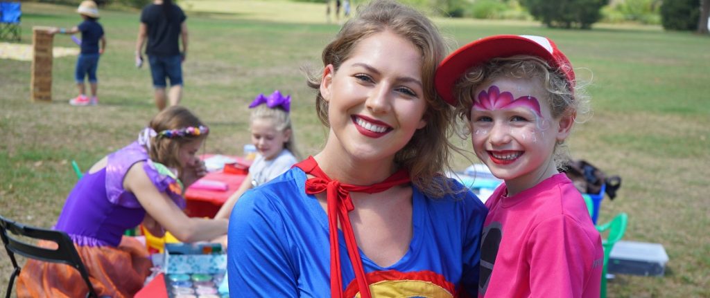 image of Supergirl as a kids party entertainer for corporate events with Superheroes Inc